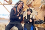 shah rukh khan net worth, shahrukh khan filmography, shah rukh khan and his son abram trolled for sporting native american war bonnets, Trifle